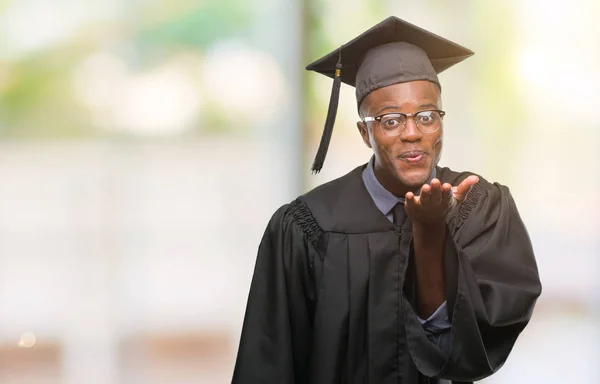 Young Graduated African American Man Isolated Background Looking Camera Blowing — Stock Photo, Image