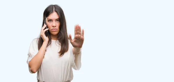 Young Beautiful Hispanic Using Smartphone Open Hand Doing Stop Sign — Stock Photo, Image