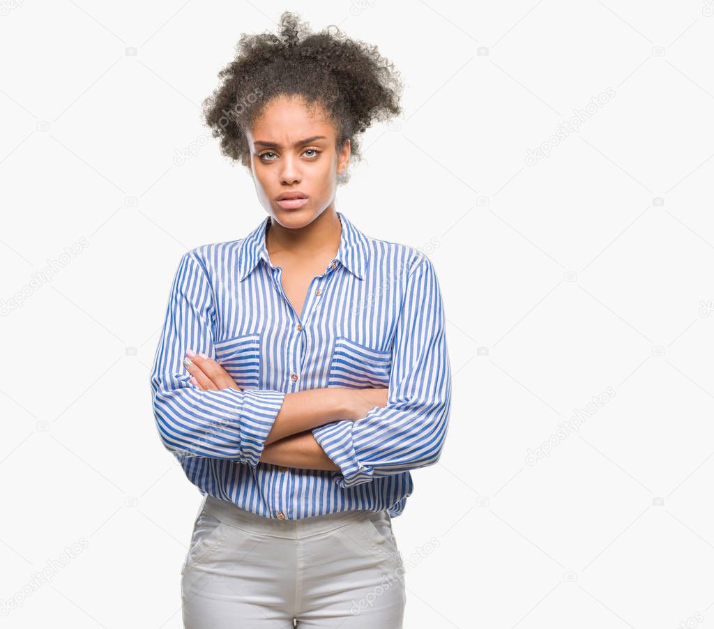 Young afro american woman over isolated background skeptic and nervous, disapproving expression on face with crossed arms. Negative person.
