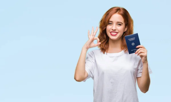 Jovem Bela Mulher Segurando Passaporte Alemanha Sobre Fundo Isolado Fazendo — Fotografia de Stock