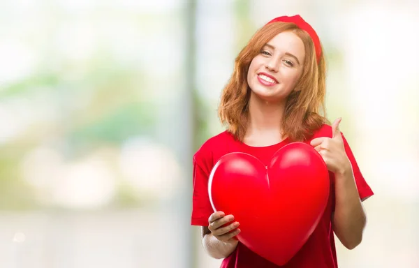 Joven Hermosa Mujer Sosteniendo Corazón Rojo Amor Sobre Fondo Aislado —  Fotos de Stock