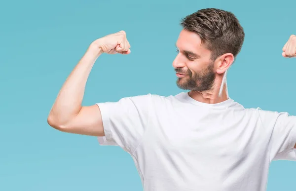 Joven Hombre Guapo Sobre Fondo Aislado Mostrando Los Músculos Los — Foto de Stock