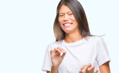Young asian woman over isolated background disgusted expression, displeased and fearful doing disgust face because aversion reaction. With hands raised. Annoying concept. clipart