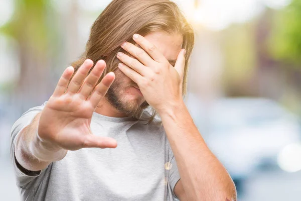 Young Handsome Man Long Hair Isolated Background Covering Eyes Hands — Stock Photo, Image