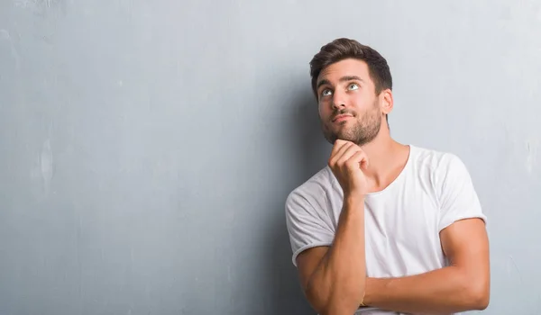 Handsome Young Man Grey Grunge Wall Hand Chin Thinking Question — Stock Photo, Image