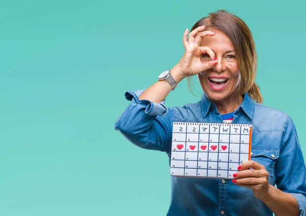 Middle Age Senior Hispanic Woman Holding Menstruation Calendar Isolated Background — Stock Photo, Image