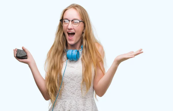 Blonde Teenager Woman Holding Smartphone Wearing Headphones Very Happy Excited — Stock Photo, Image