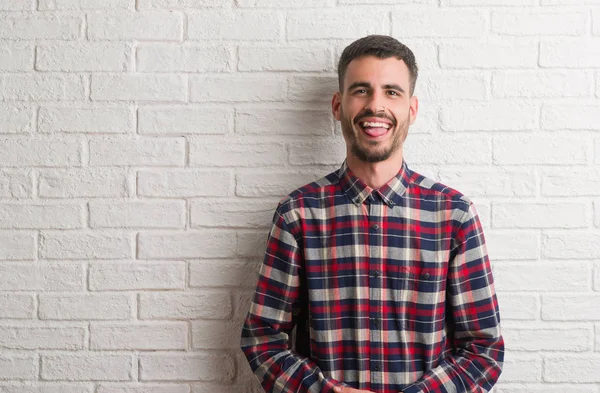 Young Adult Man Standing White Brick Wall Sticking Tongue Out — Stock Photo, Image