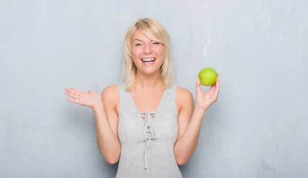 Adult Caucasian Woman Grunge Grey Wall Eating Green Apple Very Stock Image