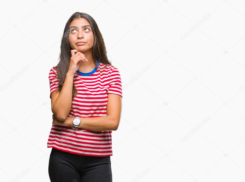 Young beautiful arab woman over isolated background with hand on chin thinking about question, pensive expression. Smiling with thoughtful face. Doubt concept.