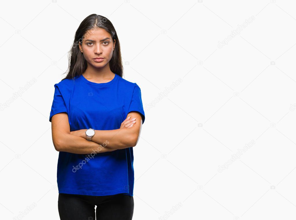 Young beautiful arab woman over isolated background skeptic and nervous, disapproving expression on face with crossed arms. Negative person.