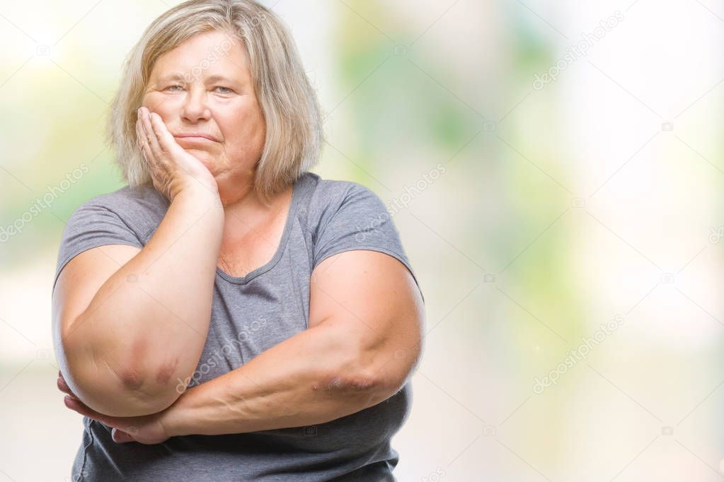 Senior plus size caucasian woman over isolated background thinking looking tired and bored with depression problems with crossed arms.
