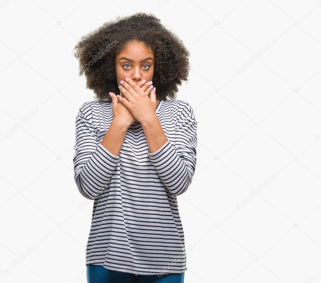 Young afro american woman over isolated background shocked covering mouth with hands for mistake. Secret concept.