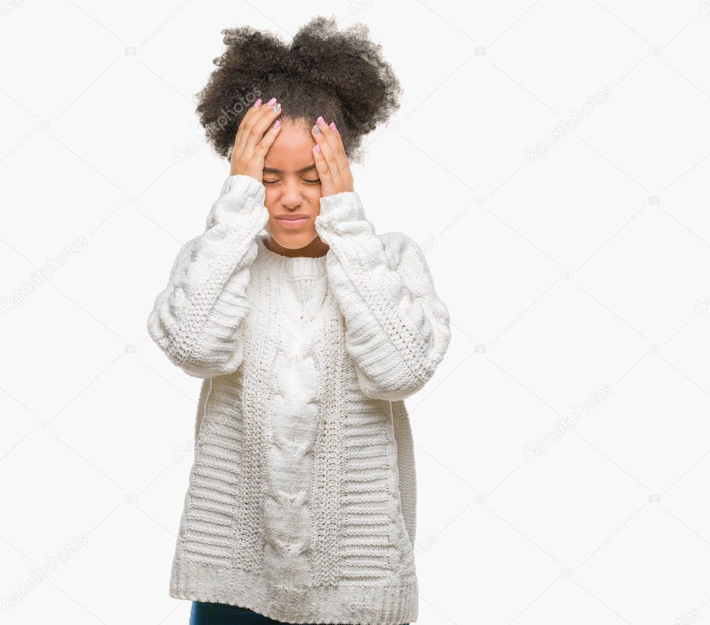 Young afro american woman wearing winter sweater over isolated background suffering from headache desperate and stressed because pain and migraine. Hands on head.