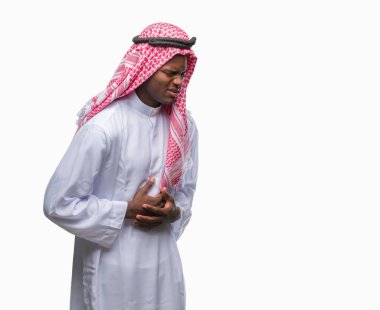 Geleneksel keffiyeh üzerinde giyen genç Arapça Afrika adam izole mide üzerinde el ile arka plan çünkü mide bulantısı, ağrılı hastalık hasta hissediyor. Ağrısı kavramı.