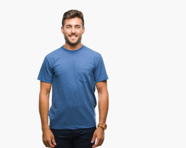 Yakışıklı delikanlı yüzünde mutlu ve güzel bir gülümseme ile izole arka plan üzerinde. Şanslı kişi.