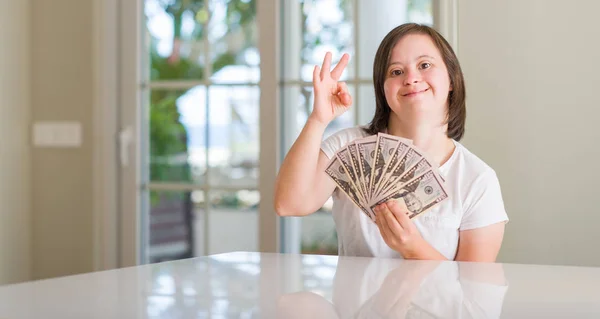 Syndrome Woman Home Holding Dollars Doing Sign Fingers Excellent Symbol — Stock Photo, Image