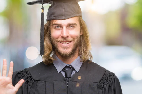 Young Handsome Graduated Man Long Hair Isolated Background Showing Pointing — Stock Photo, Image