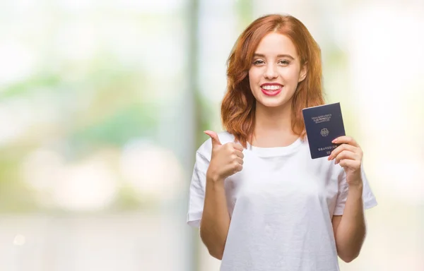 Jovem Bela Mulher Segurando Passaporte Alemanha Sobre Fundo Isolado Feliz — Fotografia de Stock