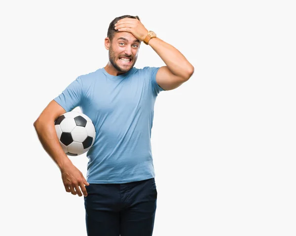 Jovem Homem Bonito Segurando Bola Futebol Sobre Fundo Isolado Estressado — Fotografia de Stock