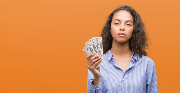 Young Hispanic Woman Holding Dollars Confident Expression Smart Face Thinking — Stock Photo, Image