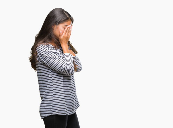 Young beautiful arab woman wearing sunglasses over isolated background with sad expression covering face with hands while crying. Depression concept.