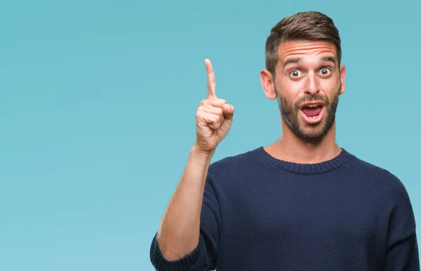 Jovem Homem Bonito Vestindo Camisola Inverno Sobre Fundo Isolado Apontando — Fotografia de Stock