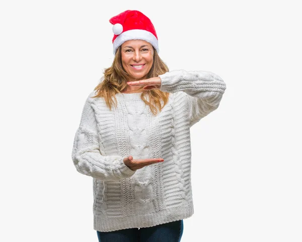 Middelbare Leeftijd Senior Spaanse Vrouw Kerstmuts Dragen Geïsoleerd Achtergrond Gebaren — Stockfoto