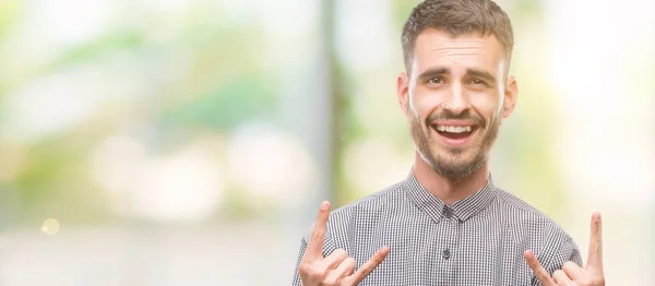 Young Hipster Man Shouting Crazy Expression Doing Rock Symbol Hands — Stock Photo, Image