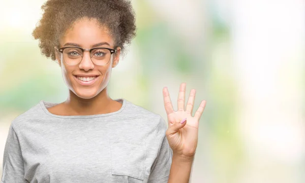 Young afro american woman wearing glasses over isolated background showing and pointing up with fingers number four while smiling confident and happy.