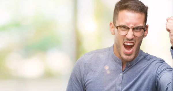 Handsome Young Elegant Man Wearing Glasses Angry Mad Raising Fist — Stock Photo, Image