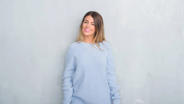 Young Adult Woman Grey Grunge Wall Wearing Winter Outfit Winking — Stock Photo, Image