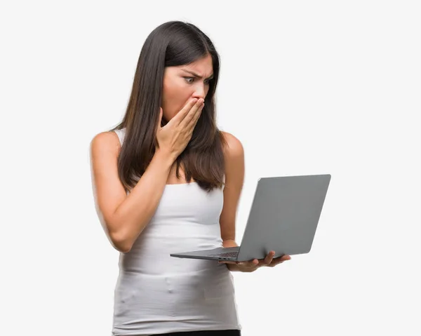 Young Hispanic Woman Using Computer Laptop Cover Mouth Hand Shocked — Stock Photo, Image