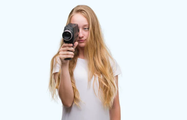 Blonde Woman Teenager Filming Holding Super Video Camera Confident Expression — Stock Photo, Image