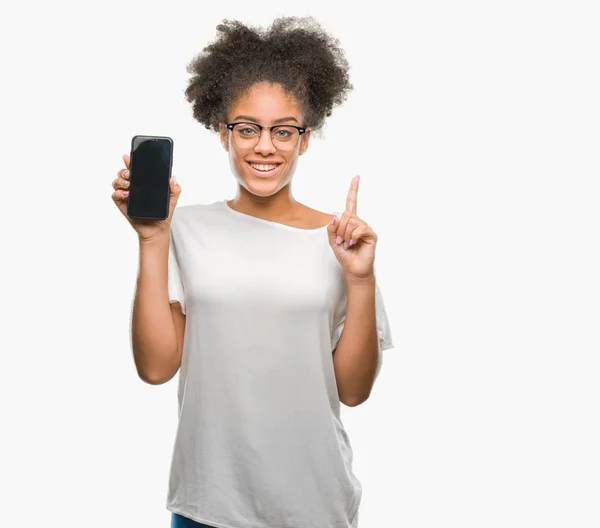 Young Beautiful Afro American Showing Smartphone Screen Isolated Background Surprised — Stock Photo, Image