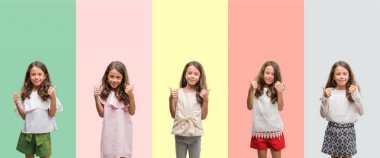 Esmer Latin kız el ile pozitif jest yapıyor farklı kıyafetler başarı işareti başparmak gülümseyen ve mutlu giyiyor kolaj. Neşeli bir ifadeyle, kazanan jest kameraya bakıyor.