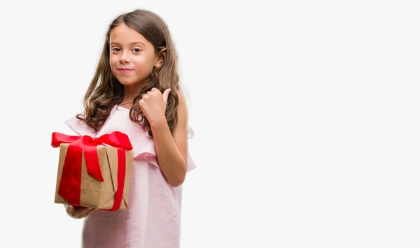 Brunette Hispanic Girl Holding Gift Happy Big Smile Doing Sign — Stock Photo, Image