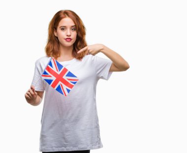 Amerika Birleşik Devletleri bayrağı sürpriz yüz işaret parmağı kendini izole arka plan üzerinde tutan genç güzel kadın