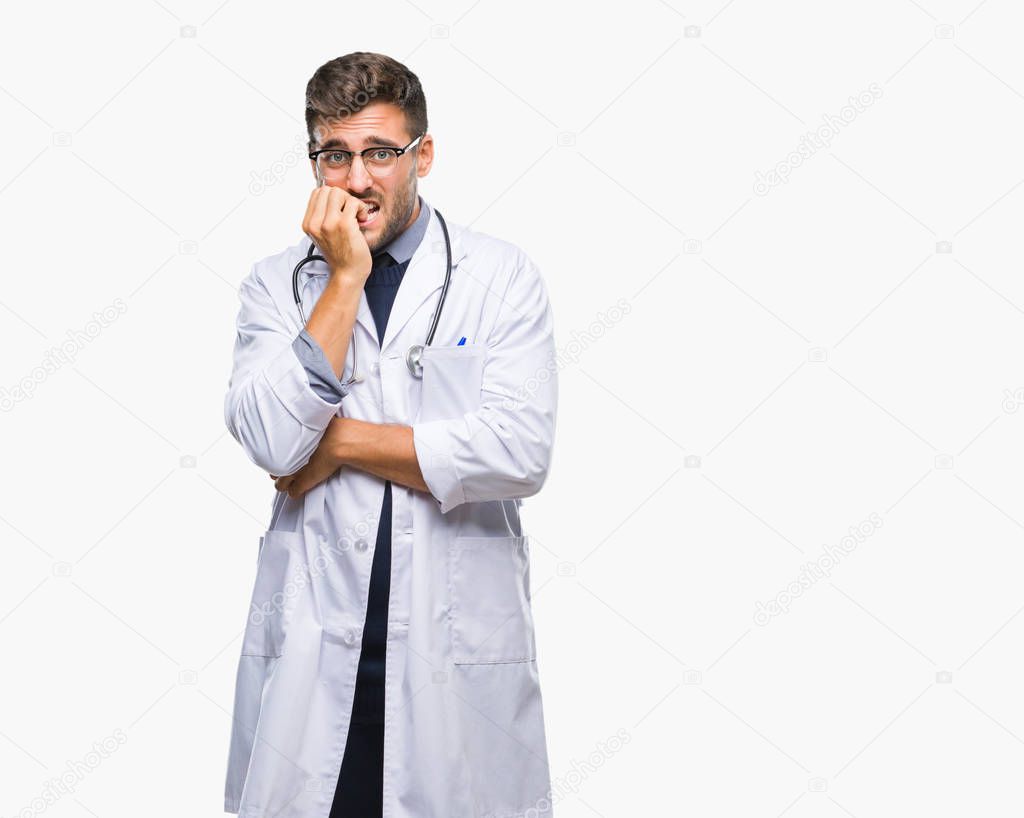 Young handsome doctor man over isolated background looking stressed and nervous with hands on mouth biting nails. Anxiety problem.