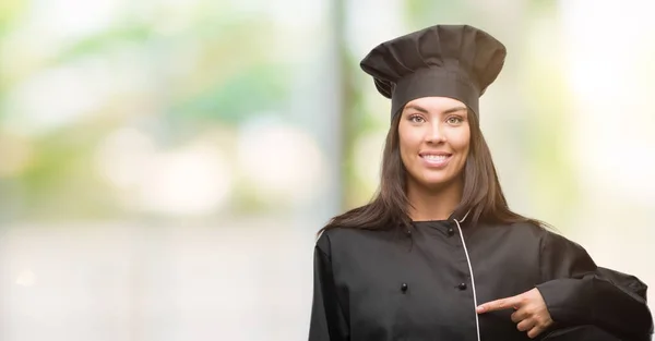 Young Hispanic Cook Woman Wearing Chef Uniform Surprise Face Pointing — Stock Photo, Image