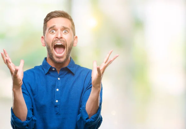 Jovem Homem Bonito Sobre Fundo Isolado Celebrando Louco Espantado Pelo — Fotografia de Stock