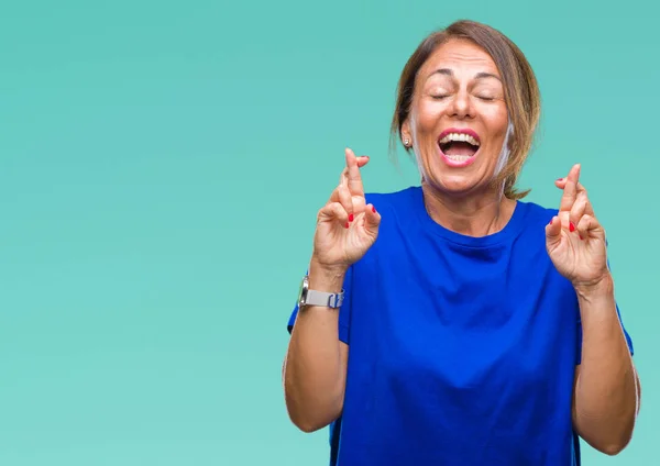 Donna Ispanica Anziana Mezza Età Sfondo Isolato Sorridendo Incrociando Dita — Foto Stock