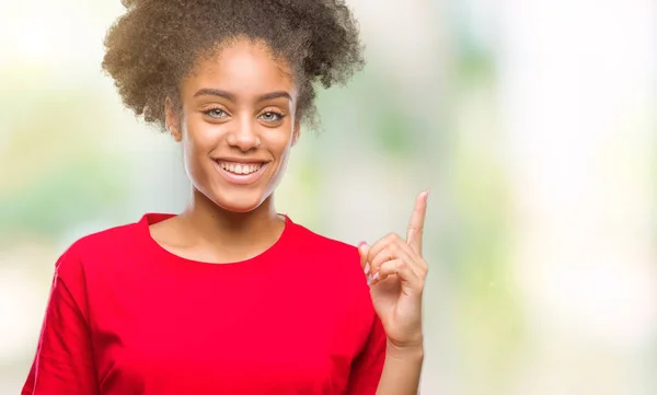 Joven Afroamericana Sobre Fondo Aislado Mostrando Señalando Con Dedo Número — Foto de Stock