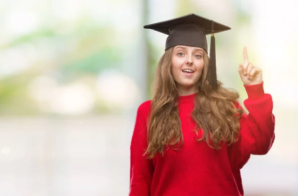 Young Blonde Woman Wearing Graduation Cap Surprised Idea Question Pointing — Stock Photo, Image