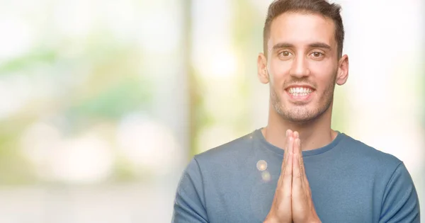 Handsome Young Casual Man Praying Hands Together Asking Forgiveness Smiling — Stock Photo, Image