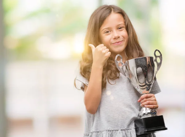 Brunette Hispanic Girl Holding Trophy Happy Big Smile Doing Sign — Stock Photo, Image
