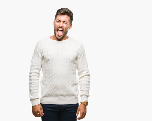 Młody Przystojny Mężczyzna Noszenia Sweter Zimowy Białym Tle Trzymanie Języka — Zdjęcie stockowe