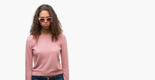 Beautiful Young Hispanic Woman Wearing Sunglasses Skeptic Nervous Frowning Upset — Stock Photo, Image