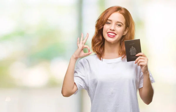 Jovem Bela Mulher Segurando Passaporte Canadá Sobre Fundo Isolado Fazendo — Fotografia de Stock