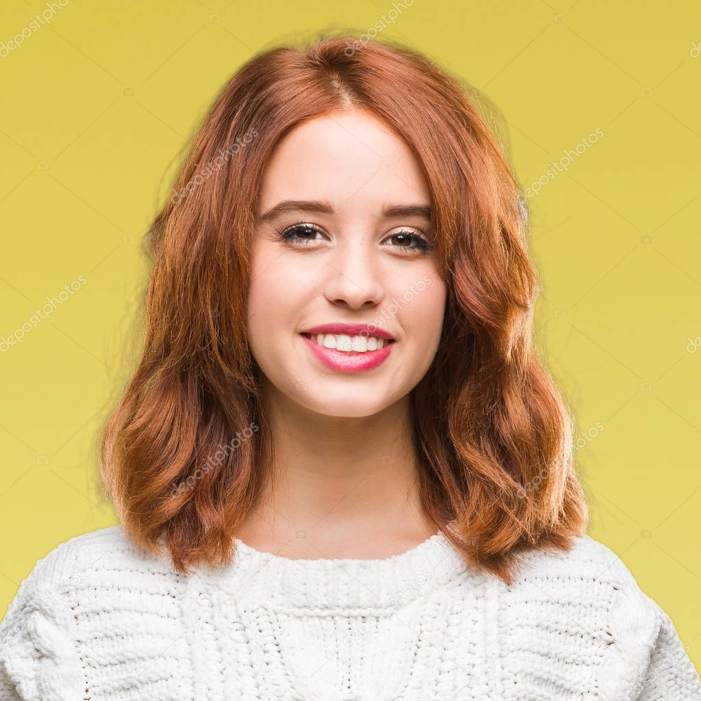 Young beautiful woman over isolated background wearing winter sweater with a happy and cool smile on face. Lucky person.